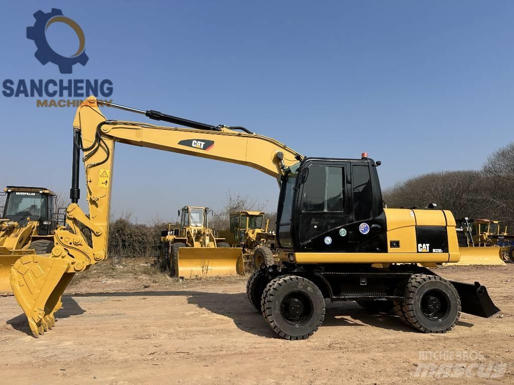 CAT M 320 D2 Колісні екскаватори