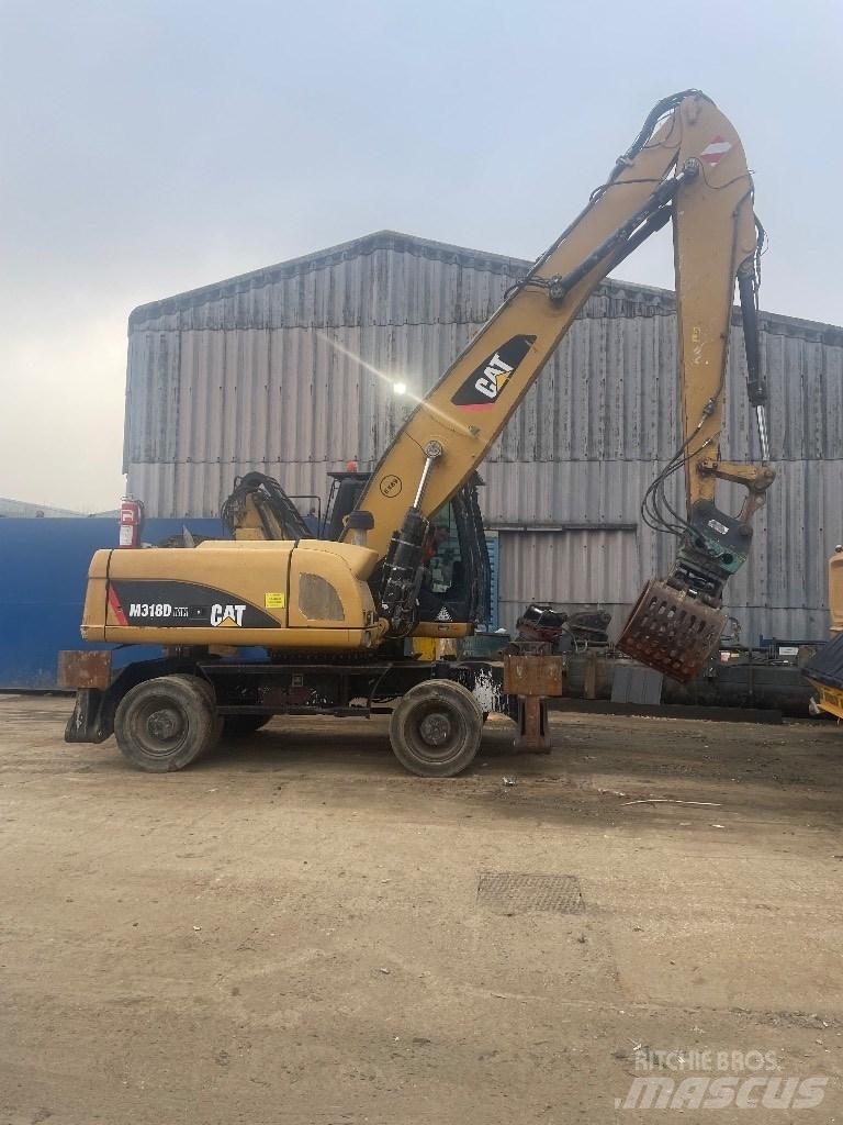 CAT 318 dmh Складська техніка - Інші