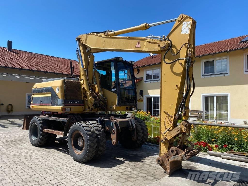 CAT M 312 Колісні екскаватори