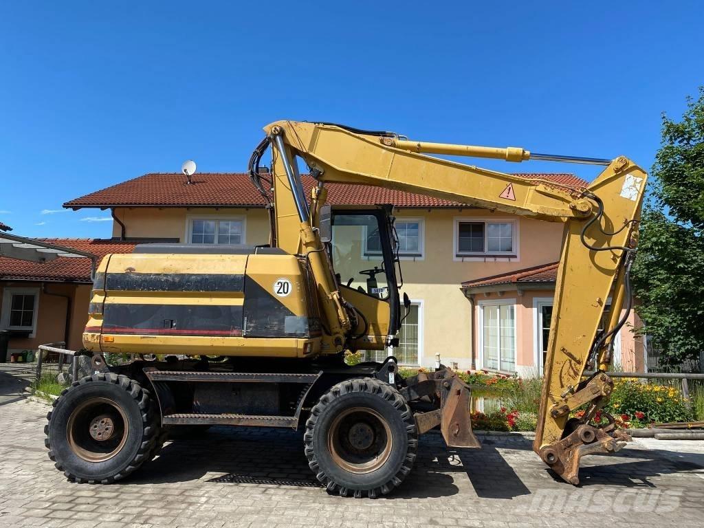 CAT M 312 Колісні екскаватори