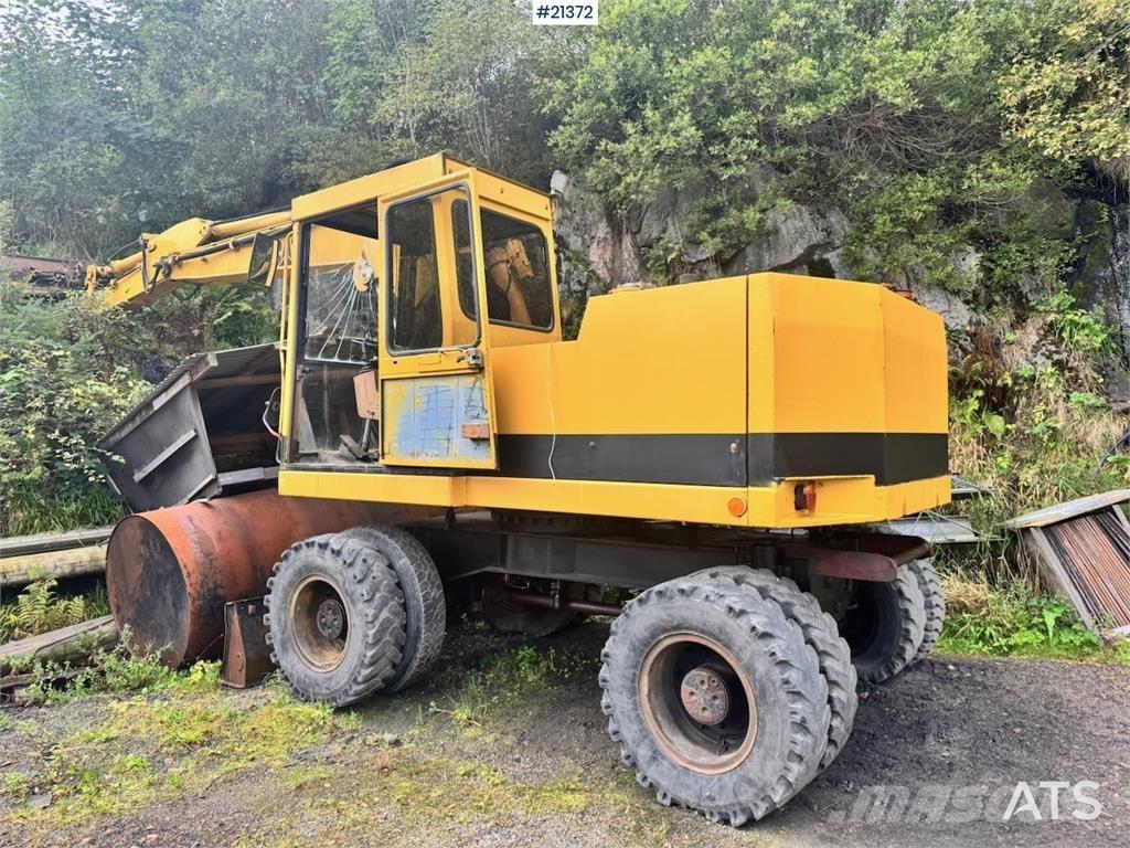 CAT 212B Колісні екскаватори