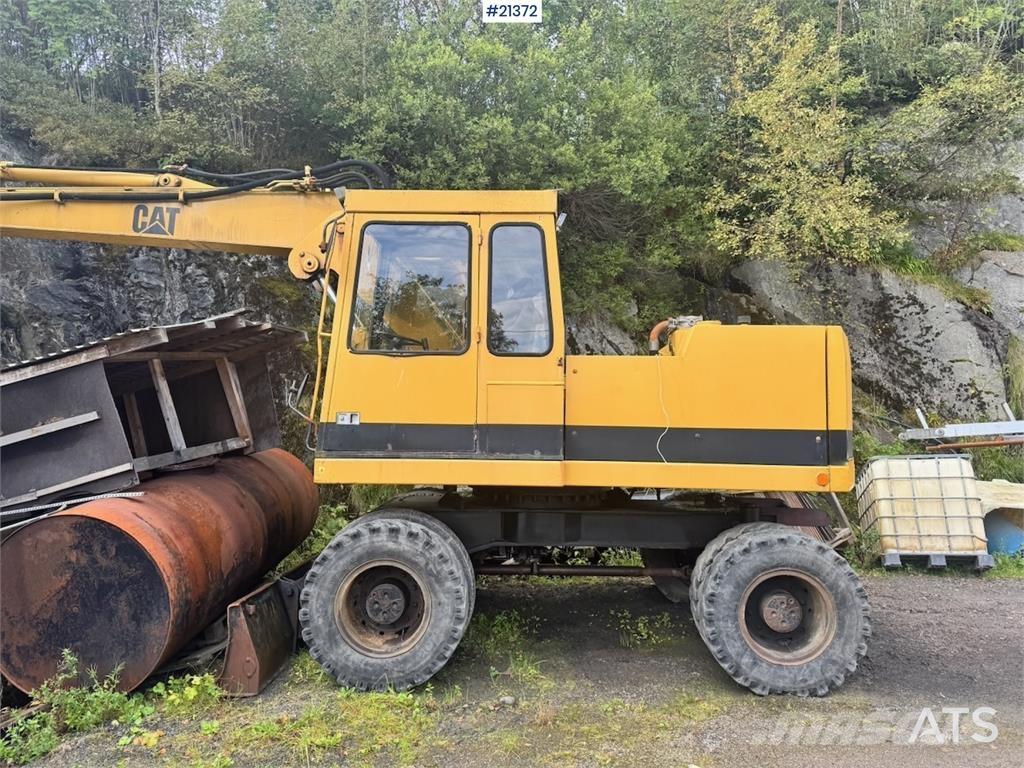 CAT 212B Колісні екскаватори