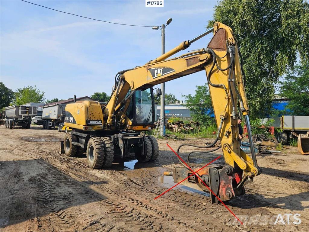CAT M313 C Колісні екскаватори