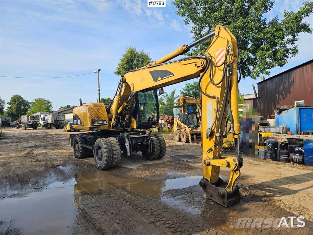 CAT M315C Колісні екскаватори