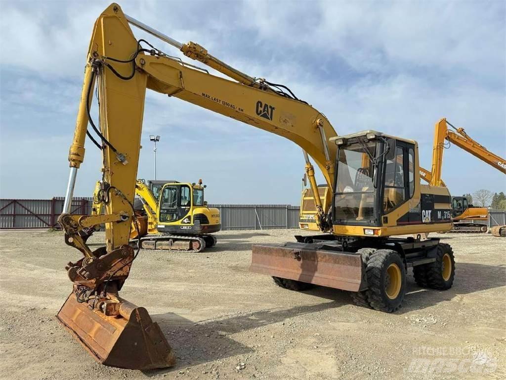 CAT M 315 Колісні екскаватори