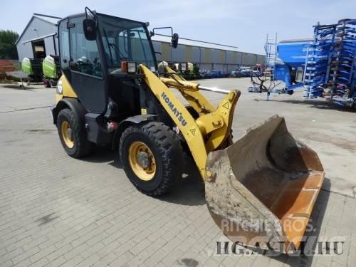 Komatsu 65 Фронтальні навантажувачі