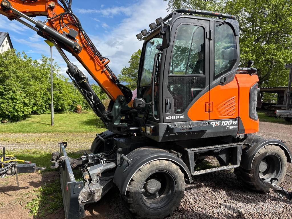 Develon DX 100 W-7 Колісні екскаватори