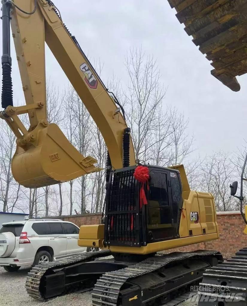 CAT 323 Гусеничні екскаватори