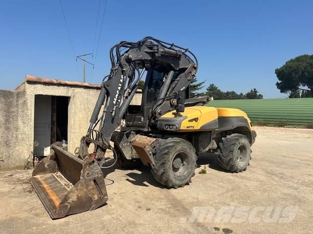 Mecalac 12 MTX Колісні екскаватори