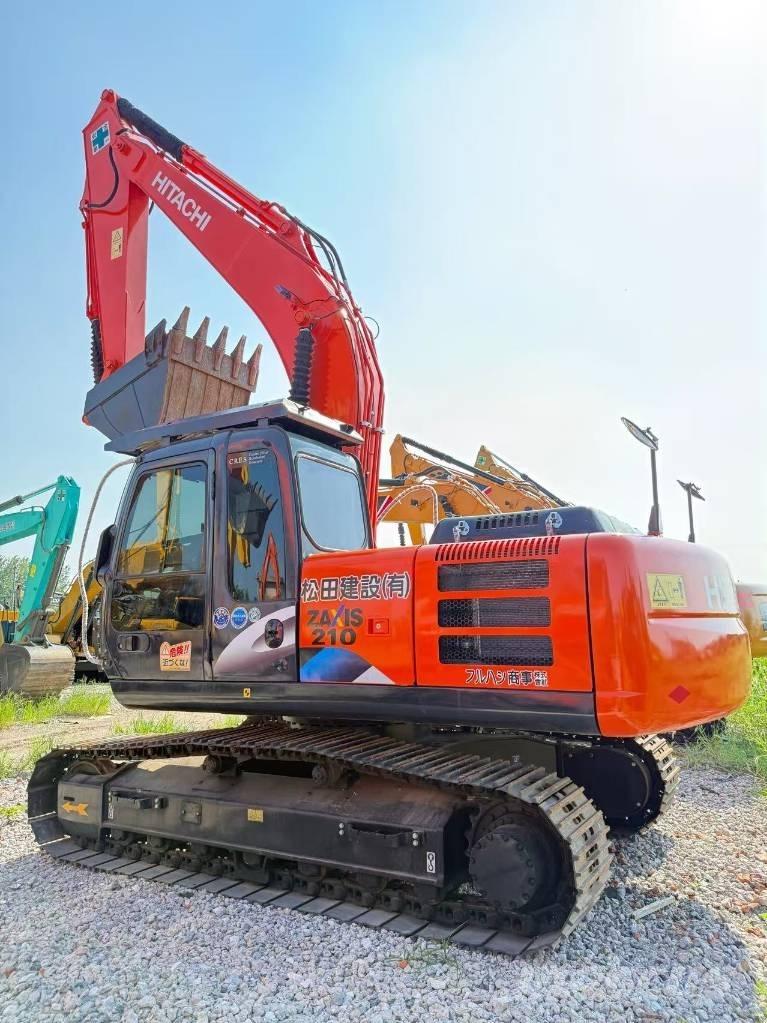 Hitachi ZX 210 Гусеничні екскаватори