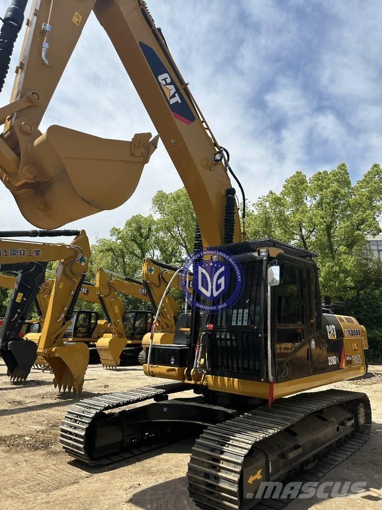 CAT CAT323 Гусеничні екскаватори