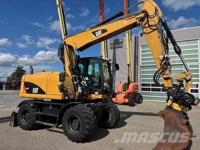 CAT M 313 D Колісні екскаватори