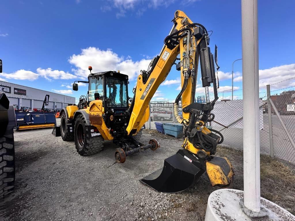 Huddig 1260 C Екскаватори-навантажувачі