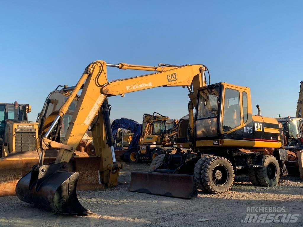 CAT M 315 Колісні екскаватори