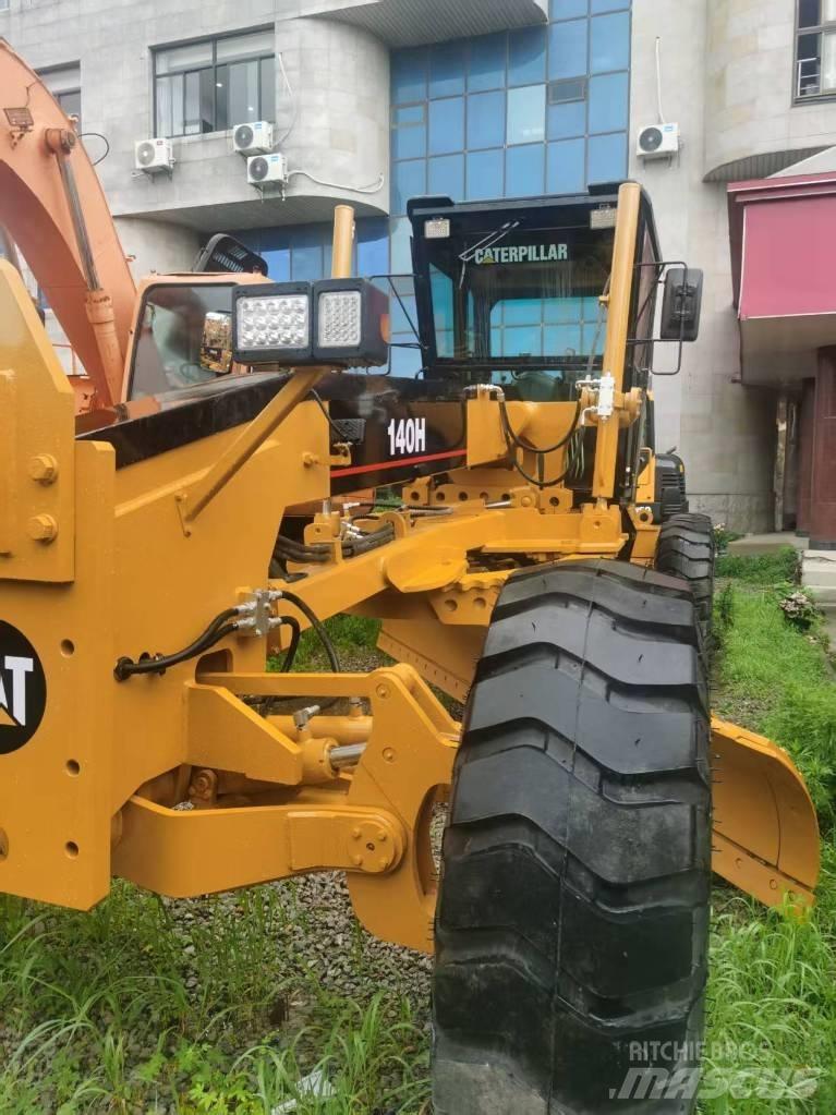 CAT 140 H Екскаватори-навантажувачі