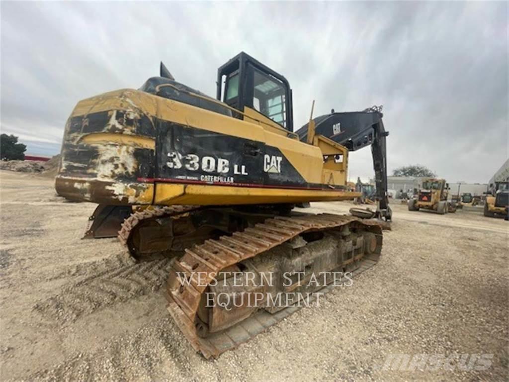 CAT 330B FM Лісогосподарські трактори