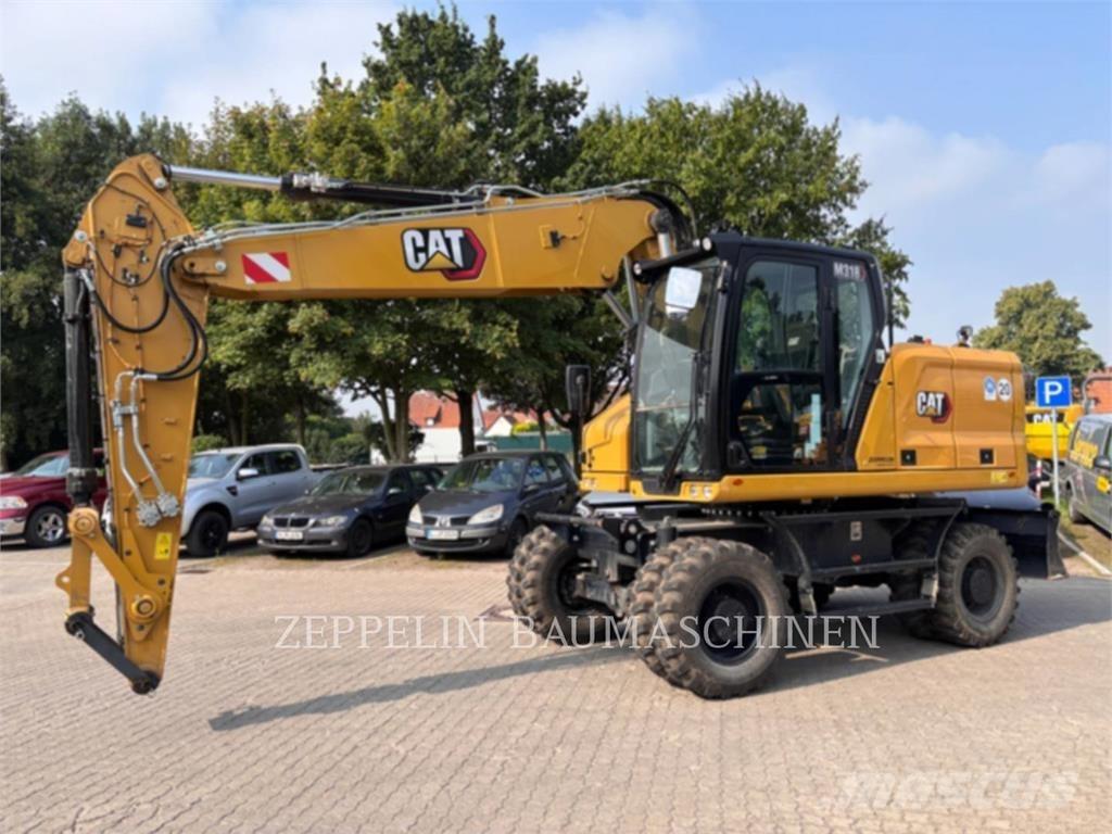 CAT M318-07A Колісні екскаватори