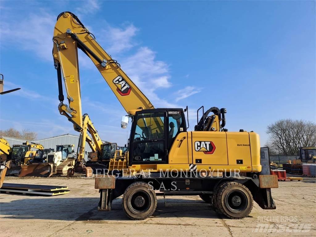 CAT MH3024 Колісні екскаватори