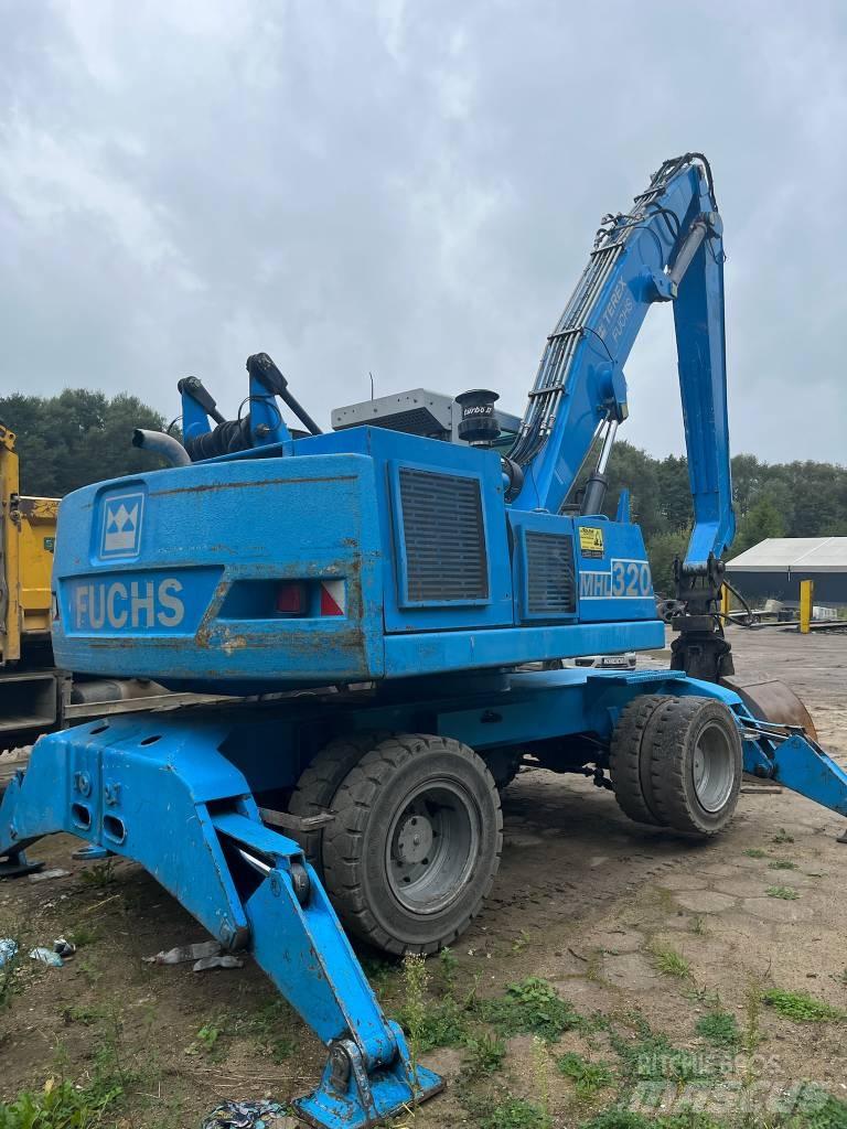 Fuchs MHL 320 Колісні екскаватори