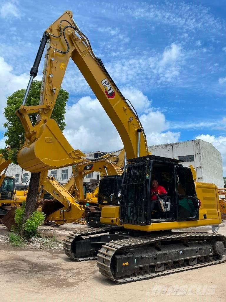CAT 323 Середні екскаватори 7т. - 12т.
