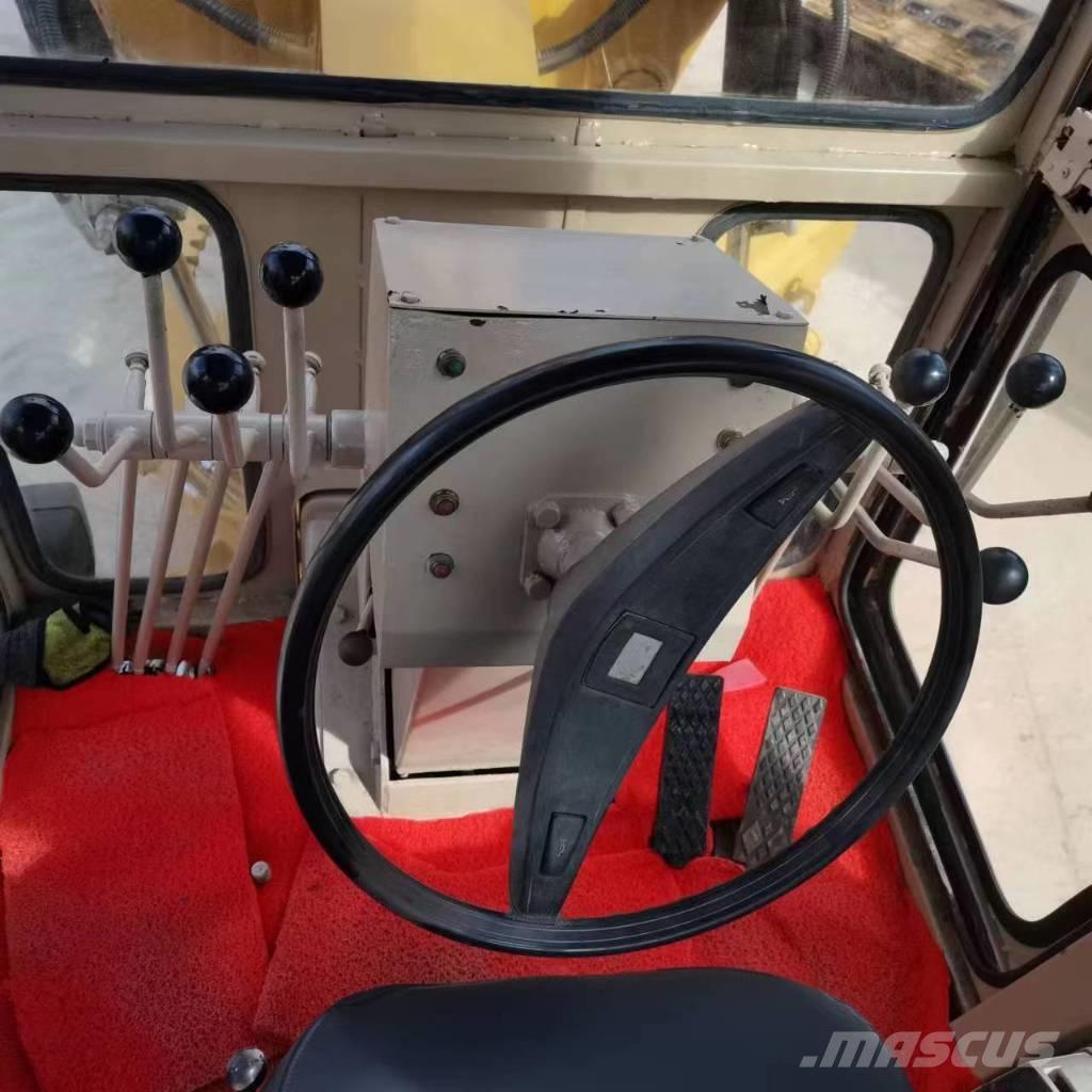 CAT 140k Грейдери