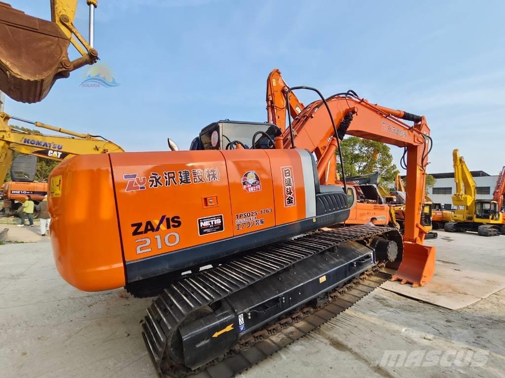 Hitachi ZX 210 Гусеничні екскаватори