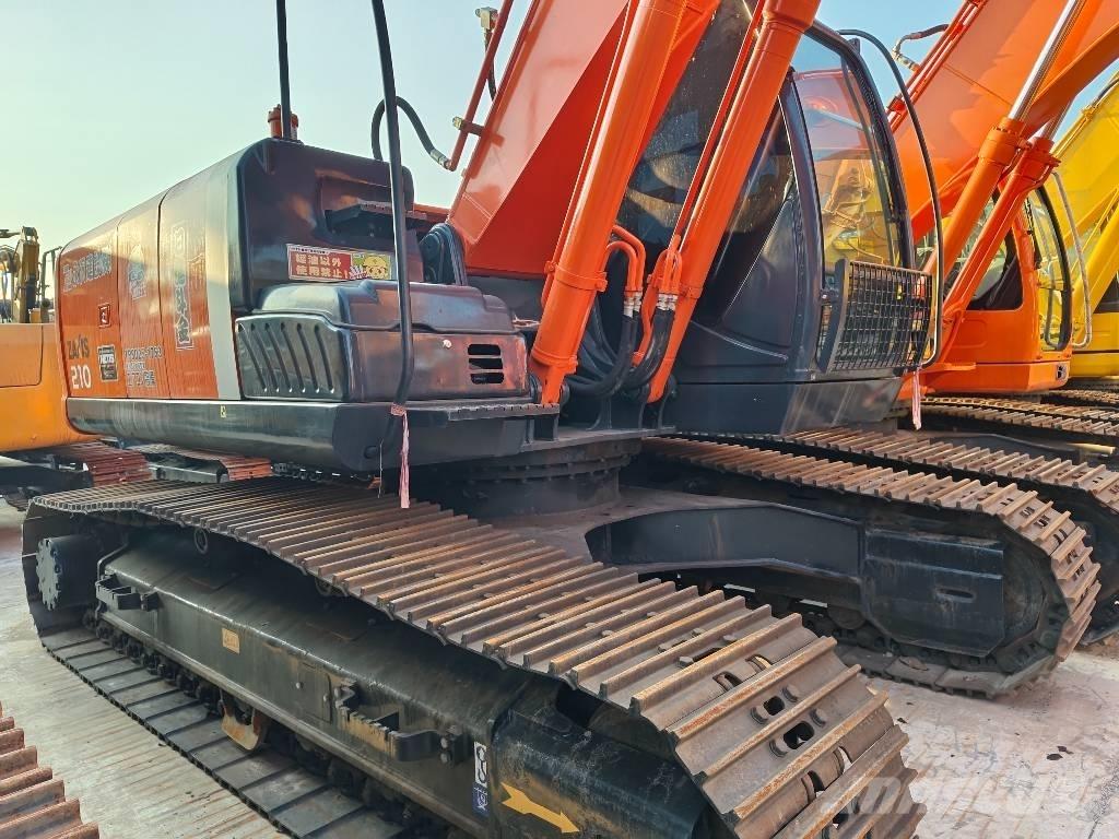 Hitachi ZX 210 Гусеничні екскаватори