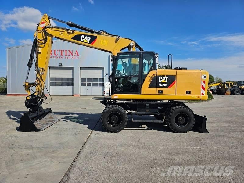 CAT M320F Колісні екскаватори