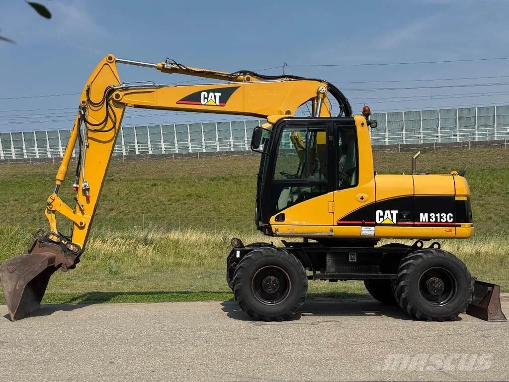 CAT M313C Колісні екскаватори