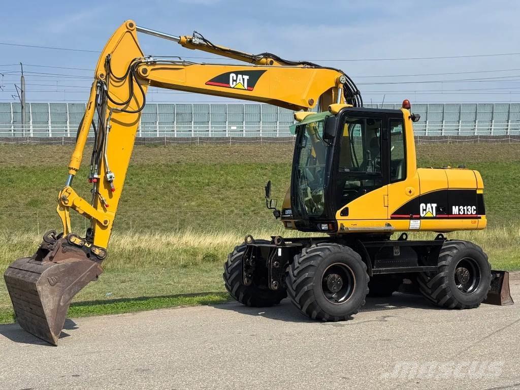 CAT M313C Колісні екскаватори