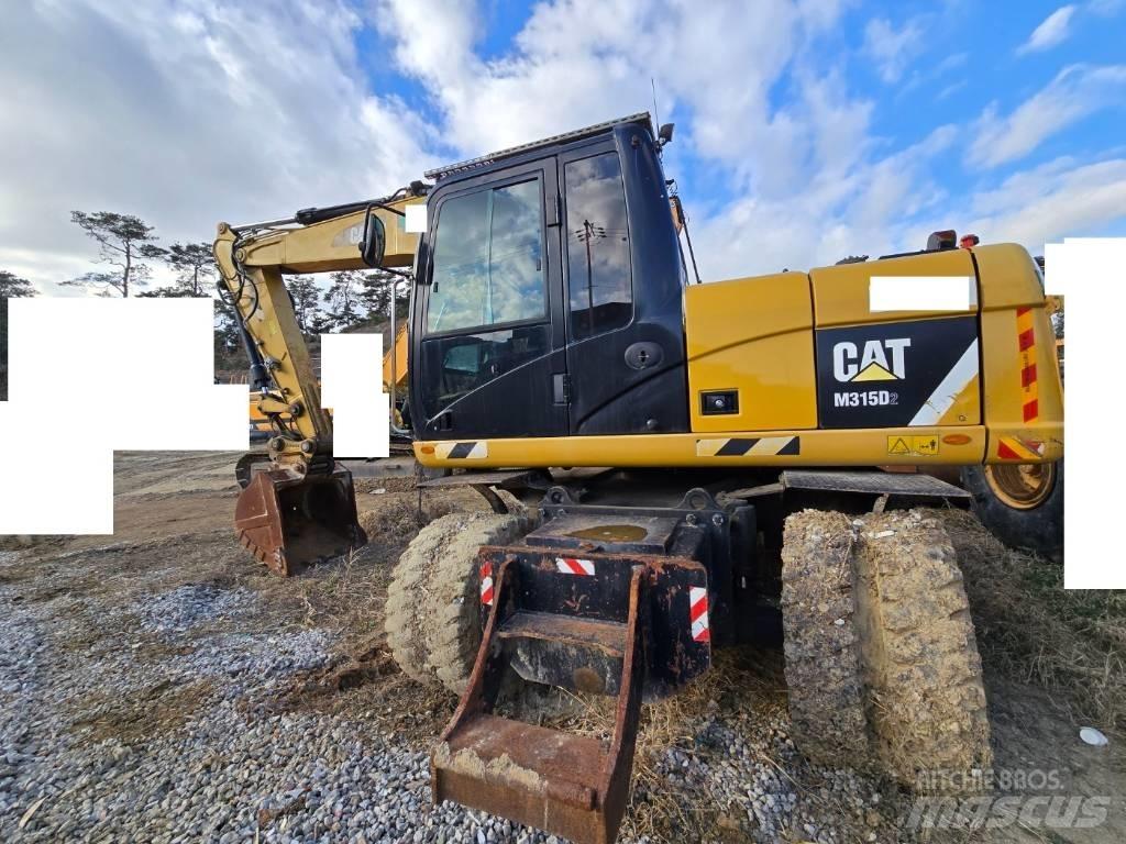 CAT M 315 D Колісні екскаватори
