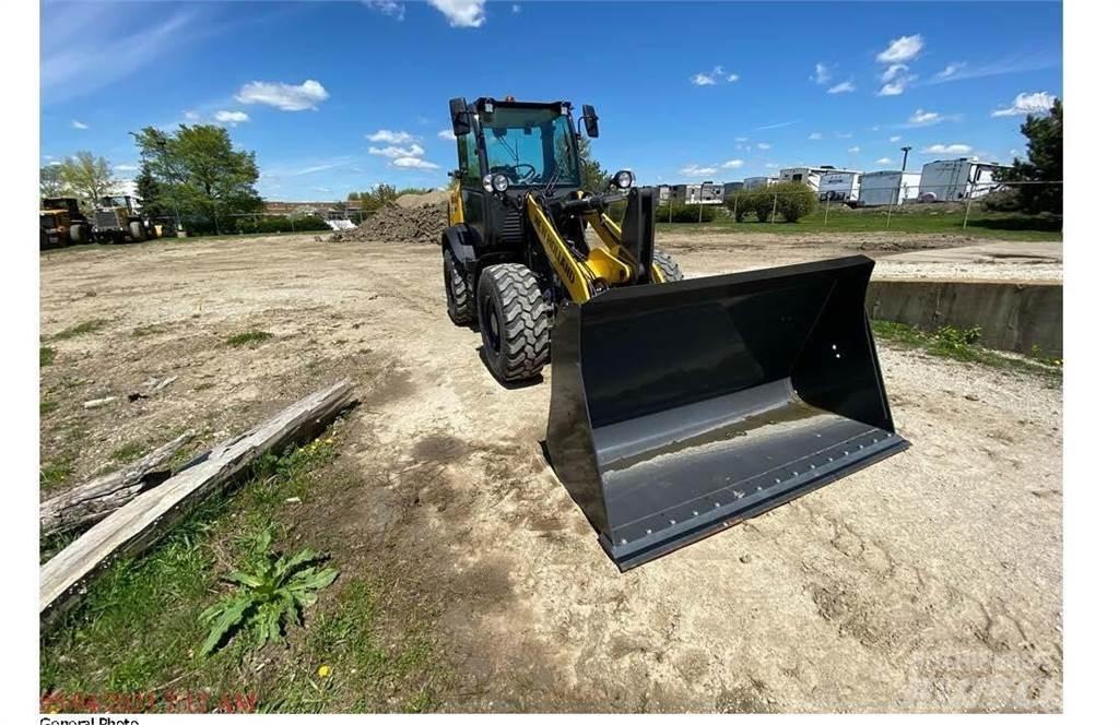New Holland W80C Фронтальні навантажувачі