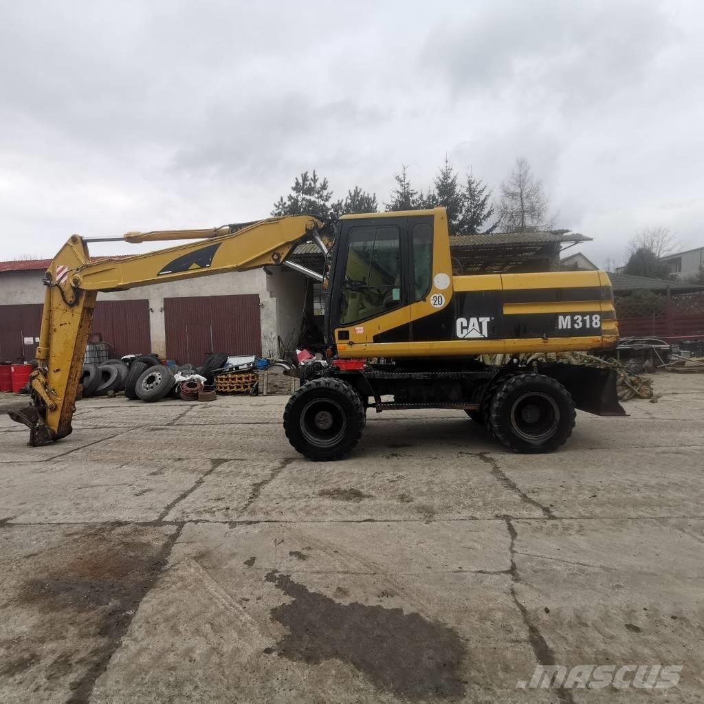 CAT M 318 B Колісні екскаватори