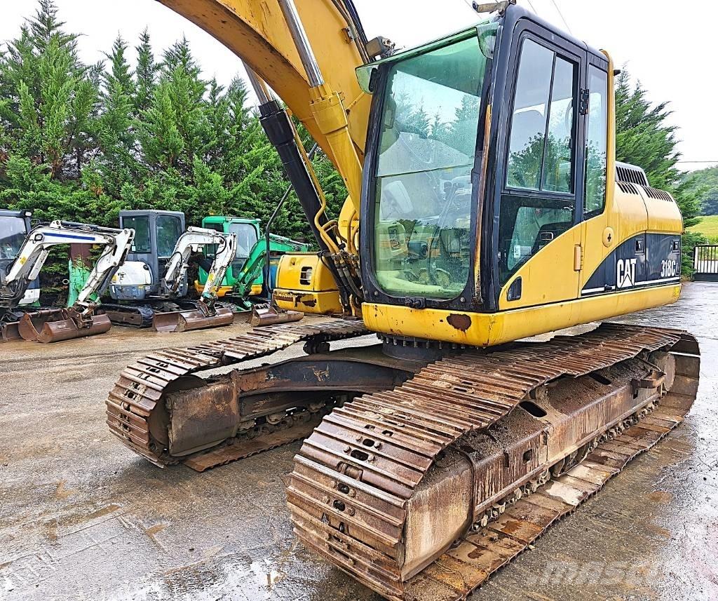 CAT 318 C Гусеничні екскаватори