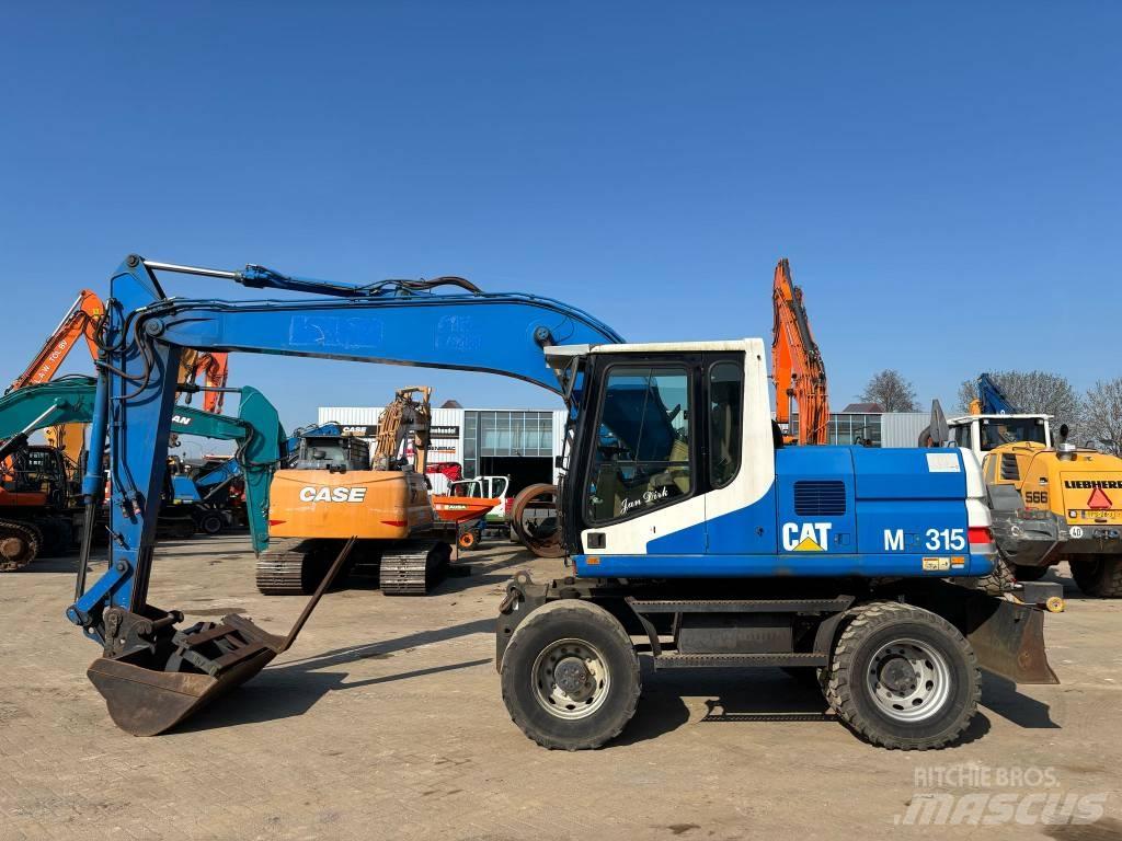 CAT M 315 Колісні екскаватори