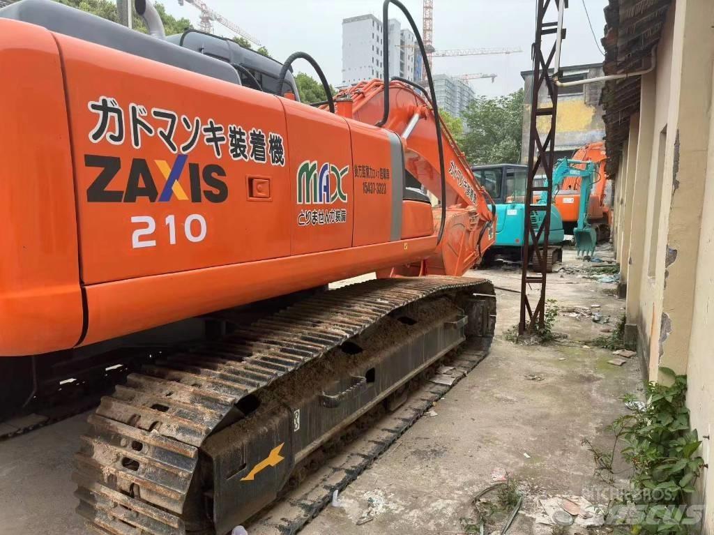 Hitachi ZX 210 Гусеничні екскаватори