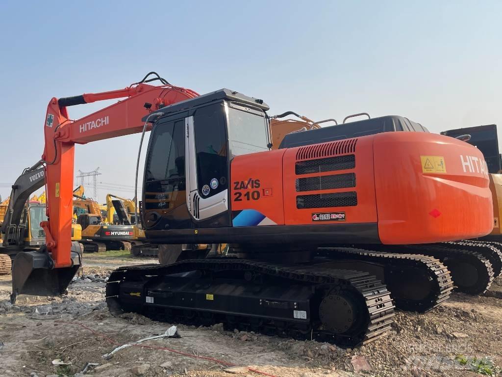 Hitachi 210LC Гусеничні екскаватори