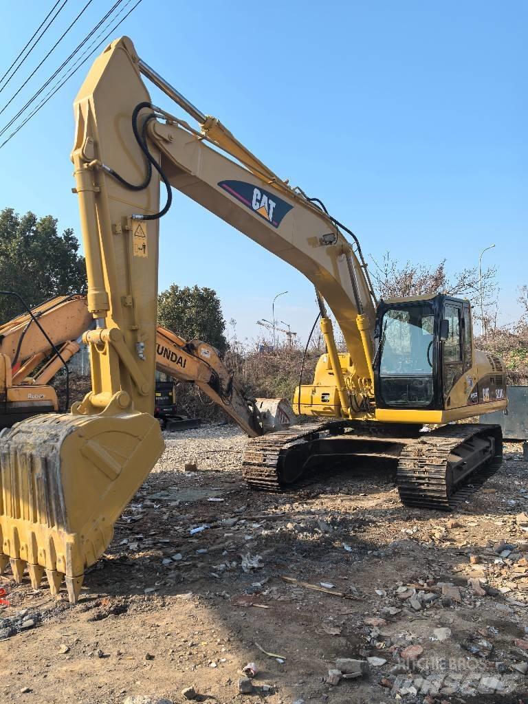 CAT 320 Гусеничні екскаватори