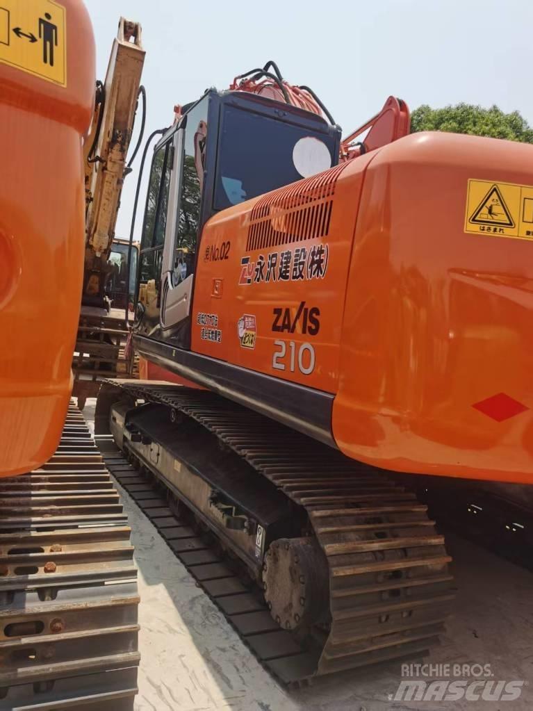 Hitachi ZX 210 Гусеничні екскаватори