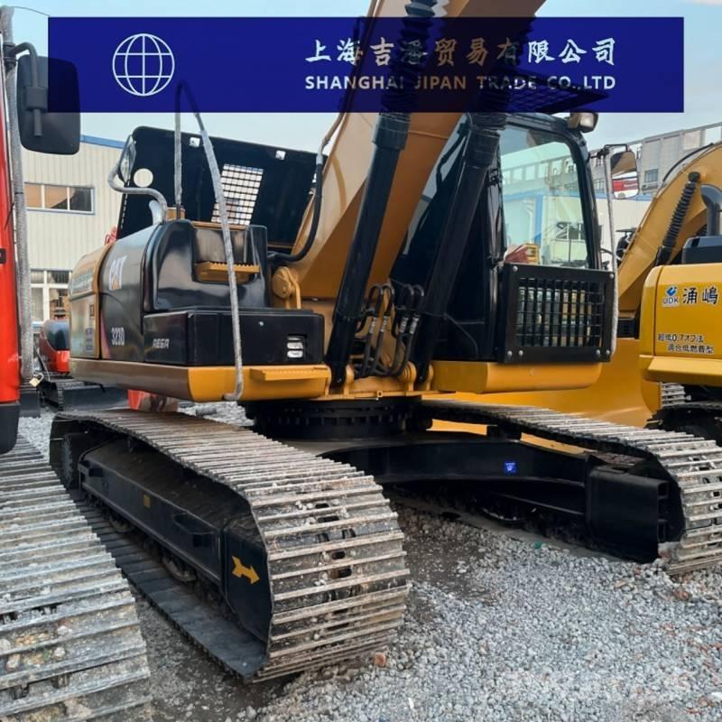 CAT 323 Гусеничні екскаватори