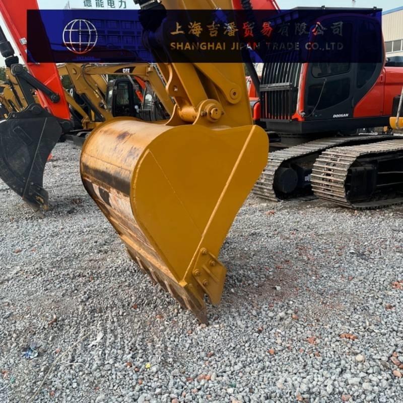 CAT 323 Гусеничні екскаватори