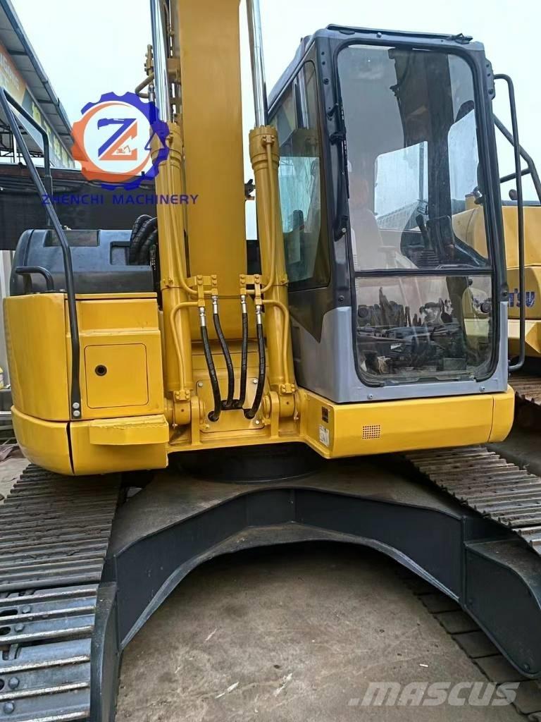 Komatsu PC 128 US Середні екскаватори 7т. - 12т.