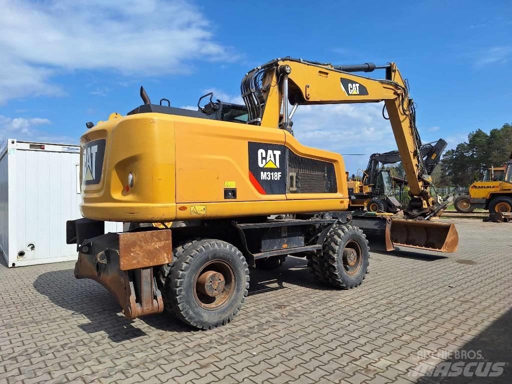 CAT M 318 F Колісні екскаватори