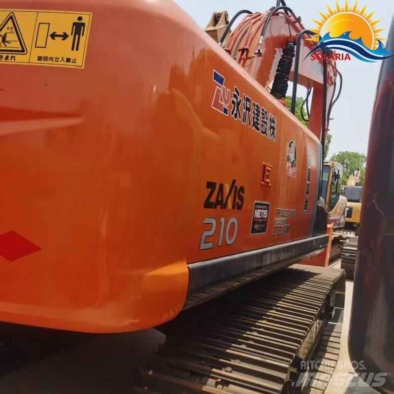 Hitachi ZX 210 Гусеничні екскаватори