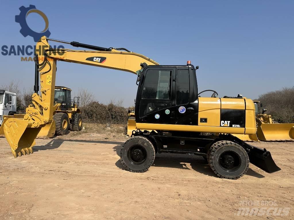 CAT M 320 D2 Колісні екскаватори