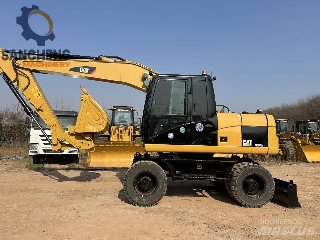 CAT M 320 D2 Колісні екскаватори