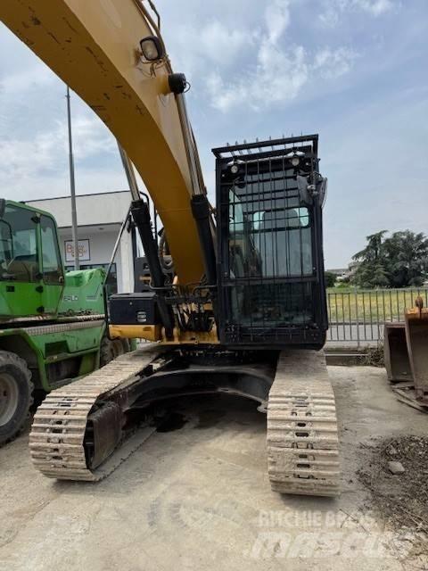 CAT 323 E Гусеничні екскаватори