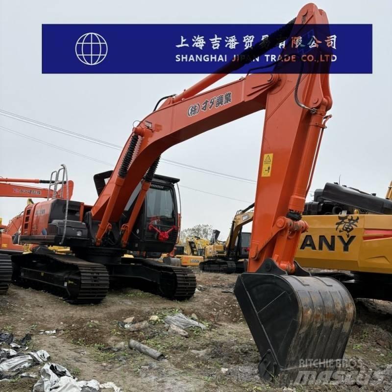 Hitachi ZX 210 Гусеничні екскаватори