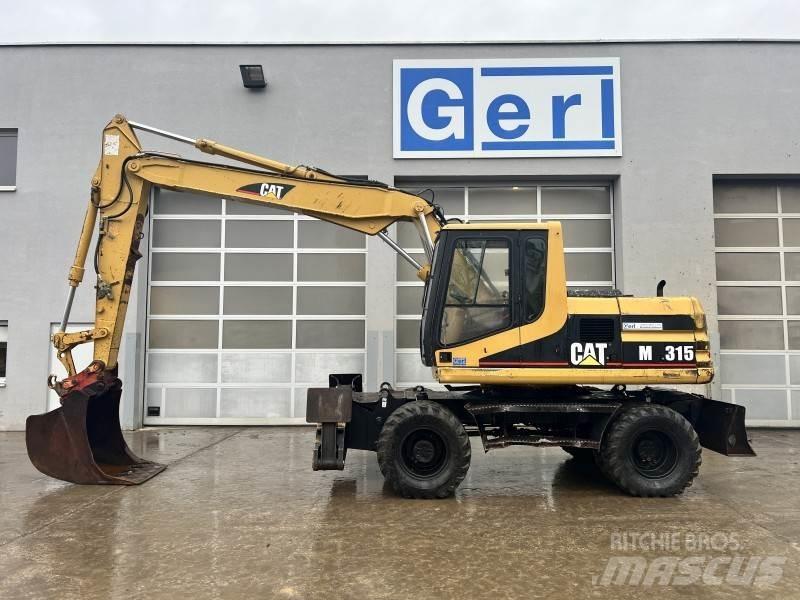 CAT M 315 Колісні екскаватори