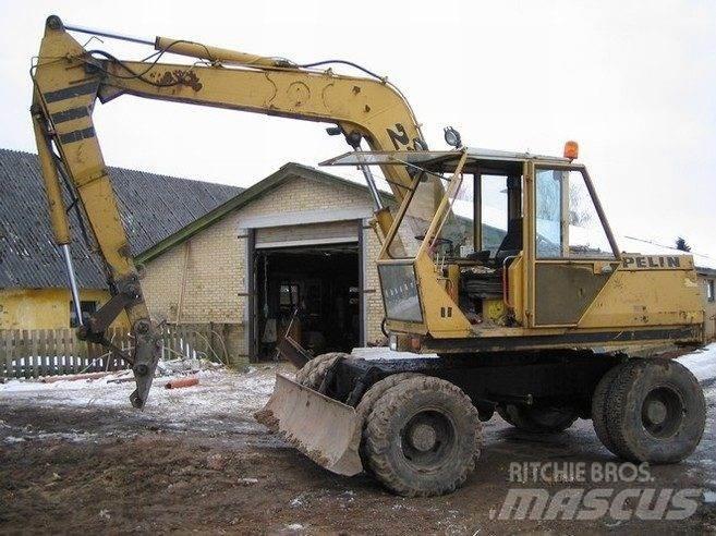CAT 212 til ophug Гусеничні екскаватори